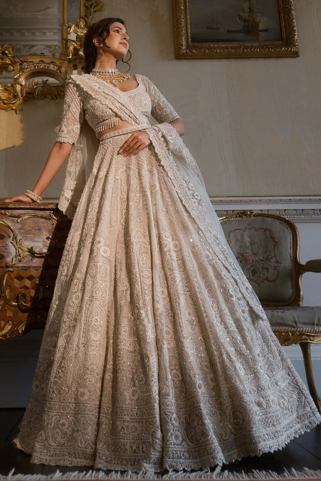 Off White Heavy Dori Embroidery Sequin Worked Lehenga in Net with Paisley and Floral Motifs