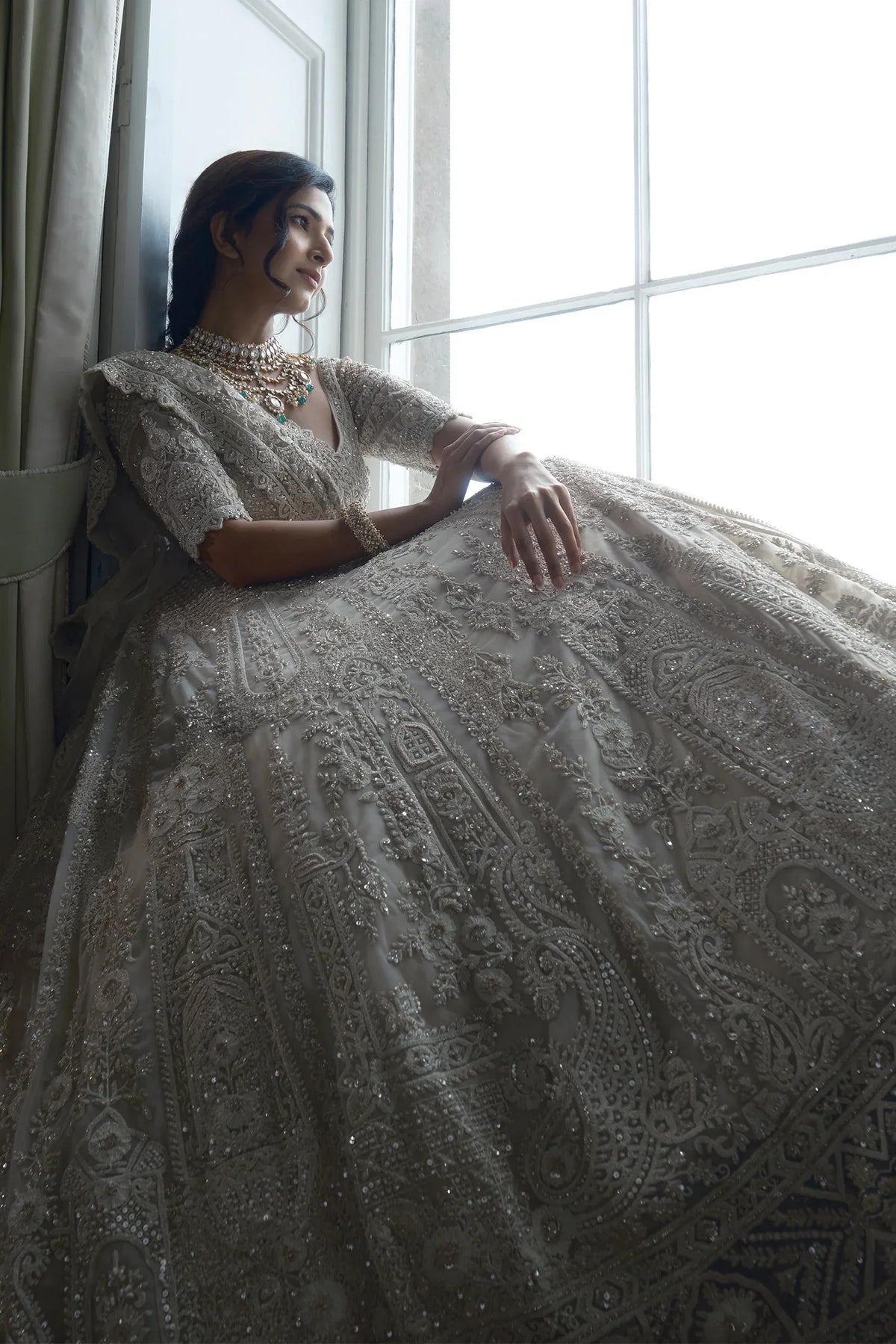 Off White Heavy Dori Embroidery Sequin Worked Lehenga in Net with Paisley and Floral Motifs